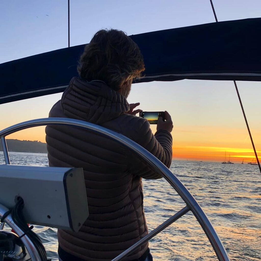 Sailing in the sunset in Lisbon with drinks