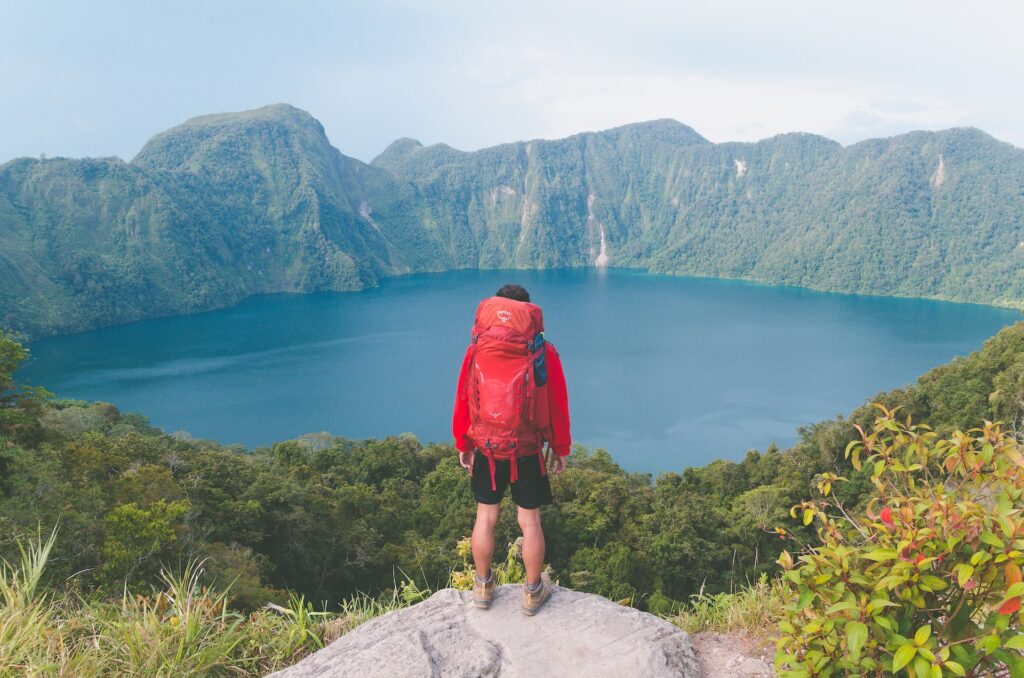 Backpacker looking at lake