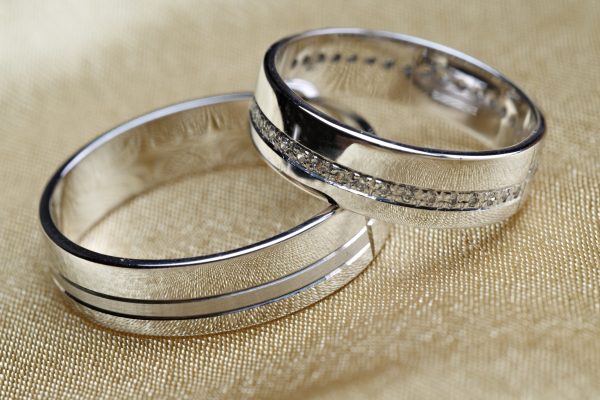 Wedding bands on golden satin