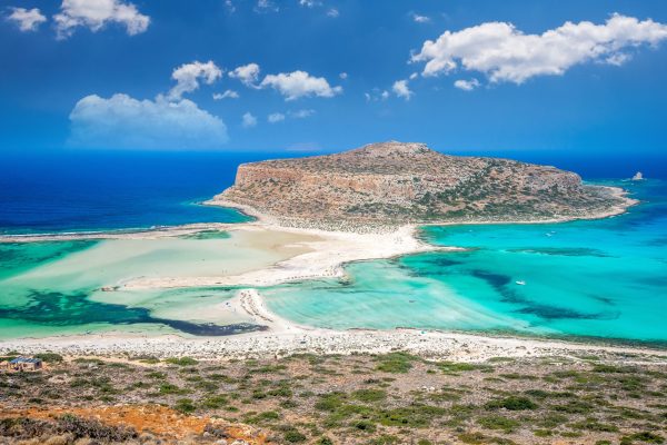 Balos,Lagoon,On,Crete,Island,,Greece.,Tourists,Relax,And,Bath