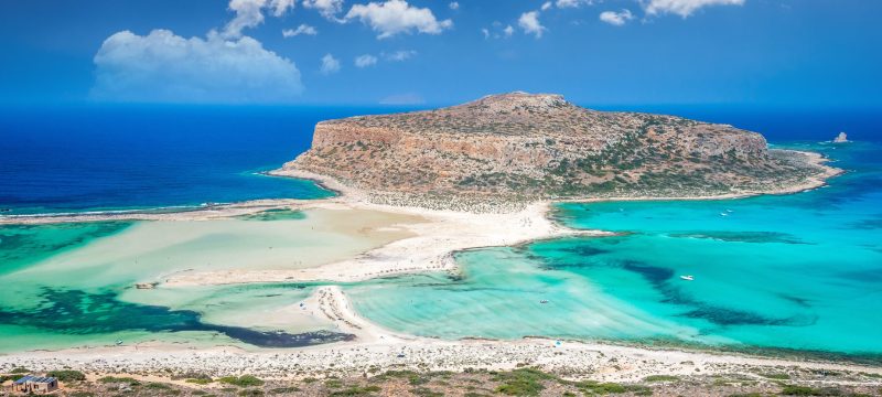 Balos,Lagoon,On,Crete,Island,,Greece.,Tourists,Relax,And,Bath